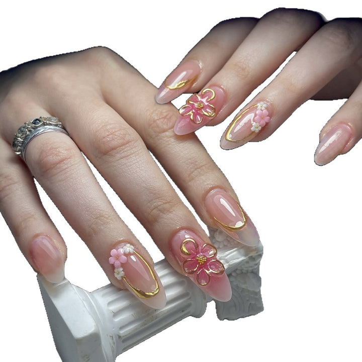 Acrylic nail set with elegant flower and gold decorations Bowlift