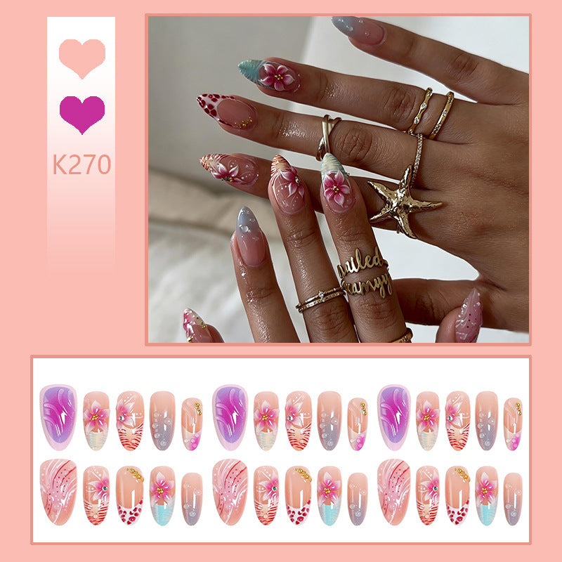 Artificial nail set with floral designs and glamorous accents Bowlift
