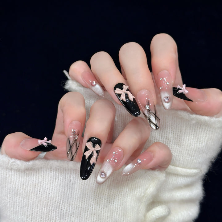 Artificial nail tips with elegant bows and glitter details Bowlift