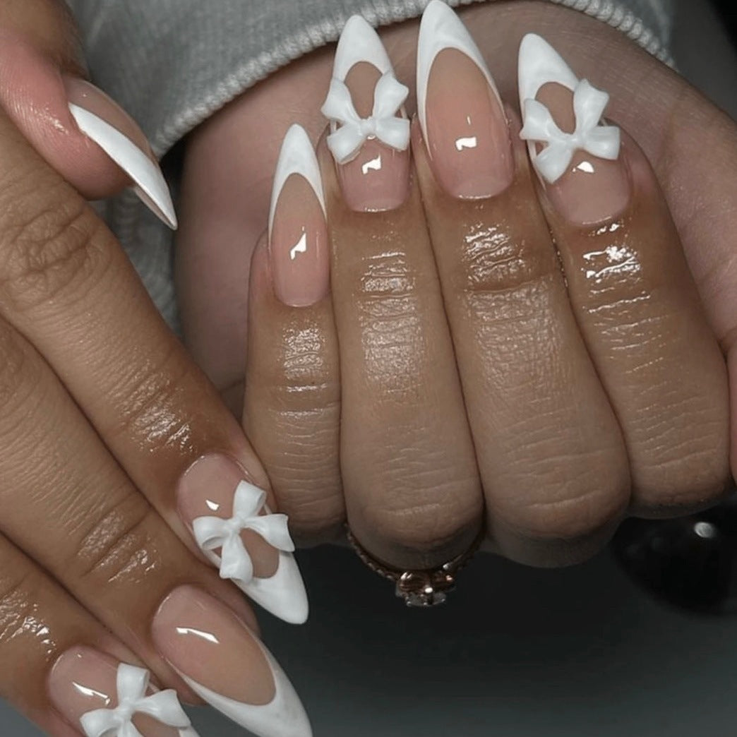 Artificial nail set with elegant tips and delicate bow decorations Bowlift