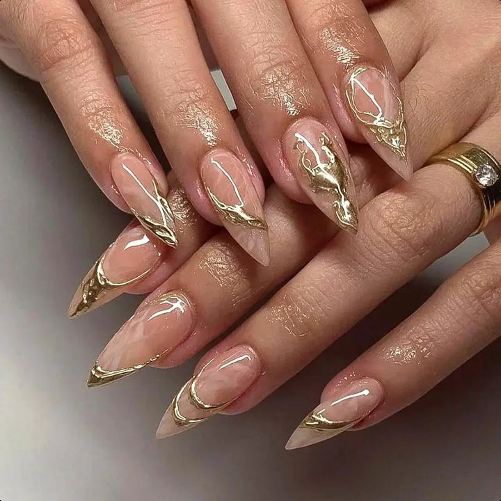 Elegant Stiletto Nail Enhancements with Gold Accent Details Bowlift