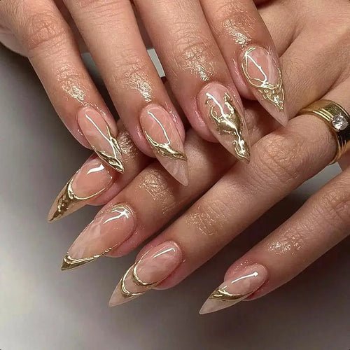 Elegant Stiletto Nail Enhancements with Gold Accent Details Bowlift