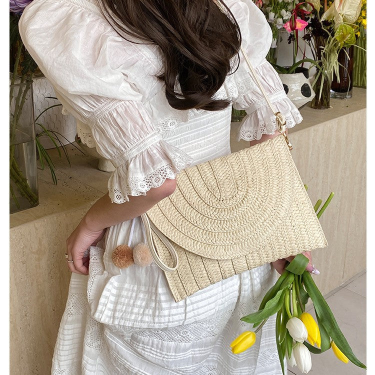 Braided shoulder bag with creative pom poms Bowlift