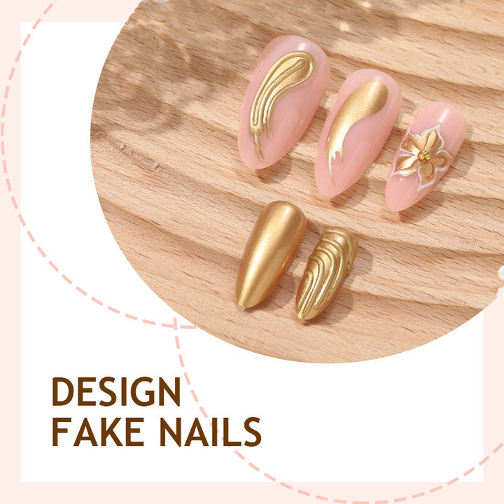 Creative nail art set with luxurious gold embellishments Bowlift