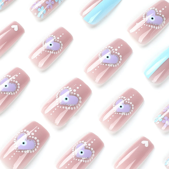 Artful nail art with floral accents and glitter embellishments Bowlift