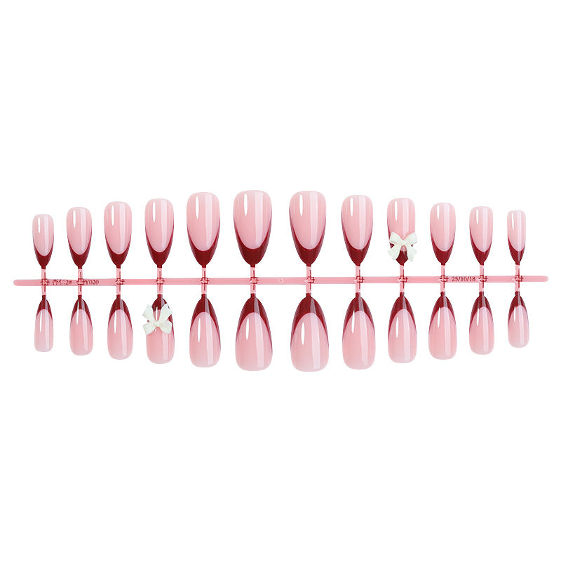 Acrylic nail set with creative French tip design and cute bows Bowlift