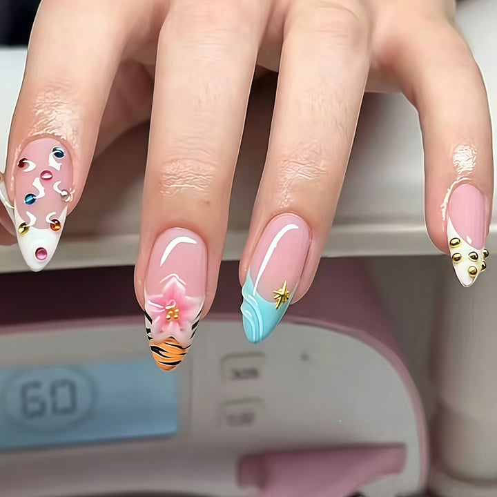 Artistic Stiletto Nail Enhancements with Unique Emblem Accents Bowlift