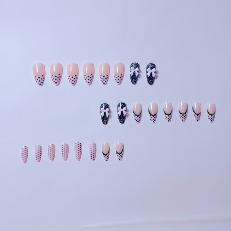 Elegant artificial nails with lace design and bow accents Bowlift