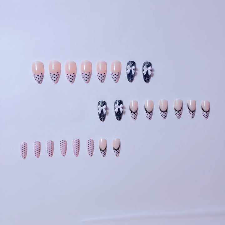 Elegant artificial nails with lace design and bow accents Bowlift