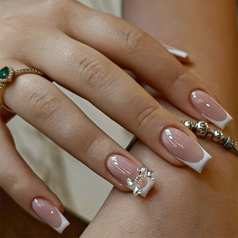 Elegant artificial nails with delicate glitter and decorative accents Bowlift