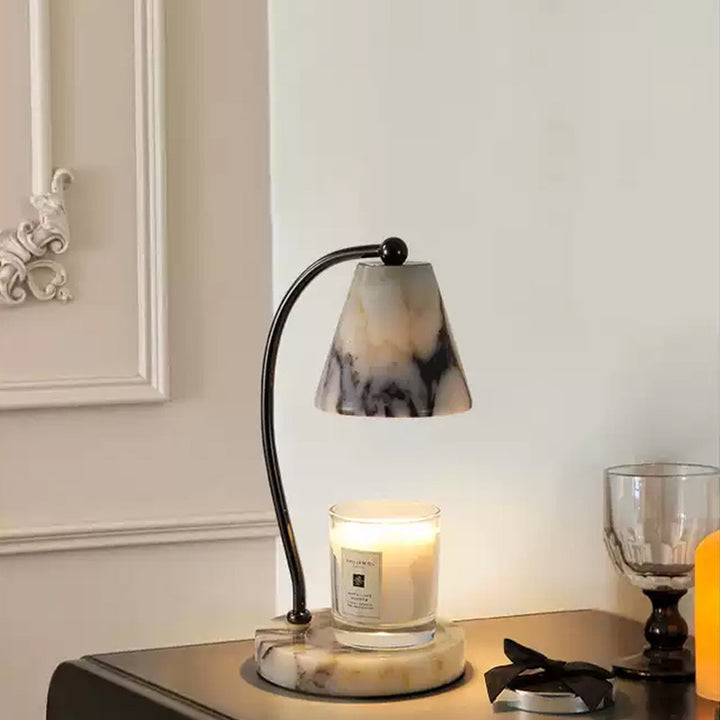Marble bedside lamp with integrated candle tray and curved metal arm Bowlift