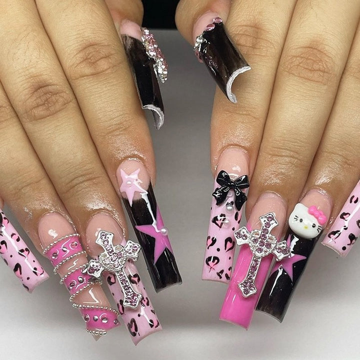 Glamorous artificial nail set with sparkling rhinestones and cross decorations Bowlift
