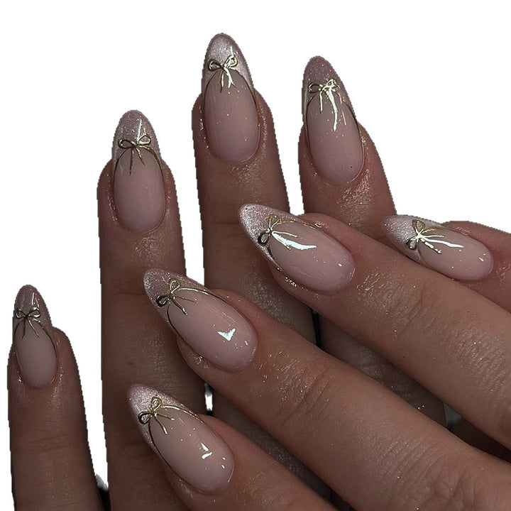 Artificial nail set with shimmering tips and elegant bows Bowlift