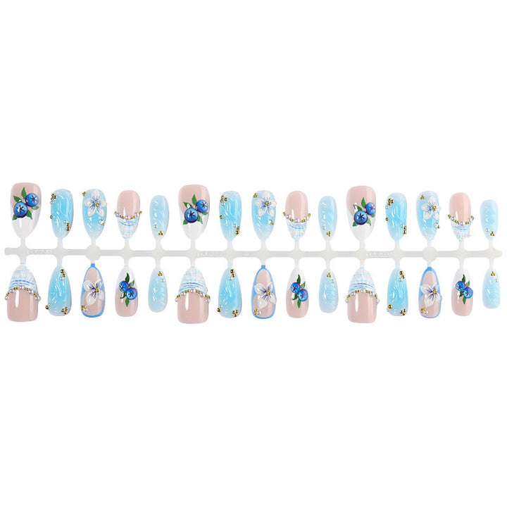 Artificial nail set with floral accents and sparkling details Bowlift