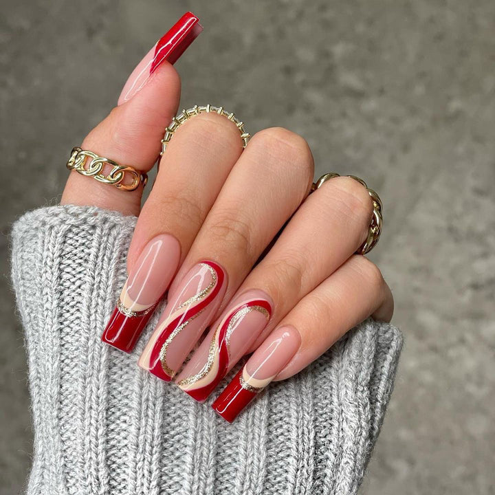 Glamorous artificial nails with elegant wave pattern and glitter accents Bowlift