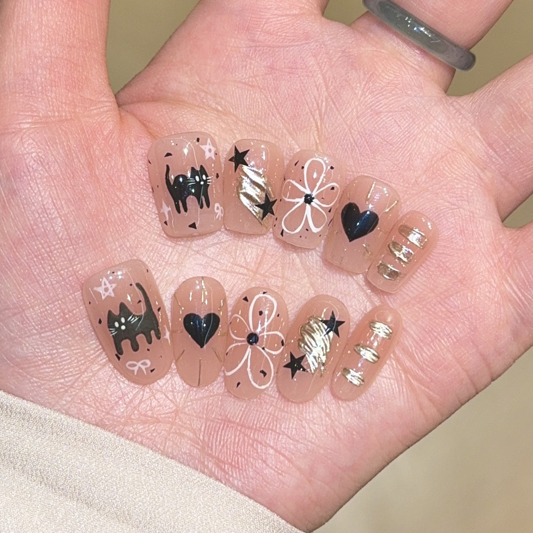 Artificial nails with unique cat and star design Bowlift