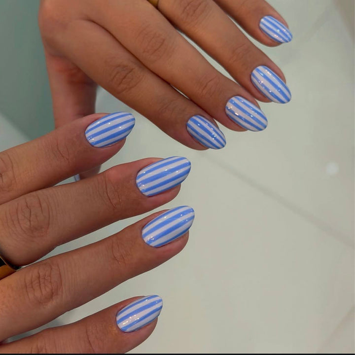 Artful nail art with maritime striped pattern Bowlift