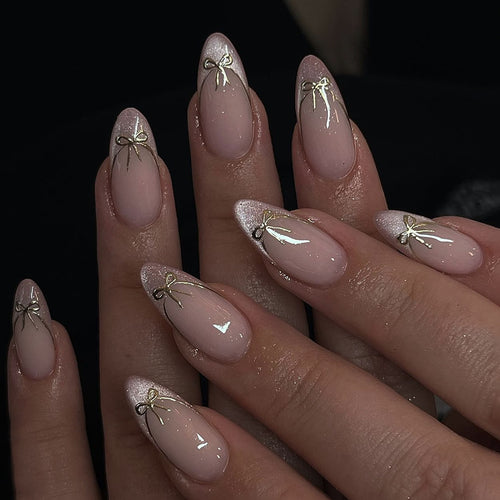Artificial nail set with shimmering tips and elegant bows Bowlift