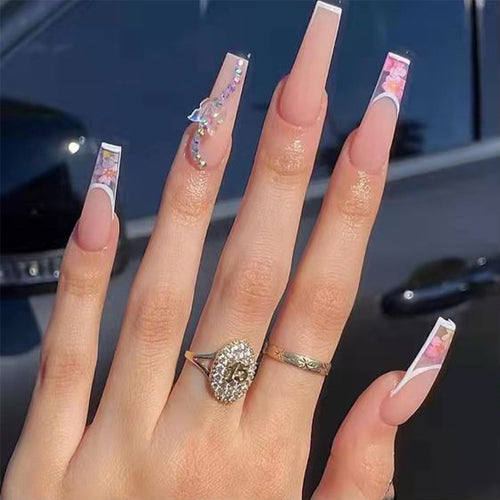 Artificail nail tips in elegant French design with floral accent Bowlift