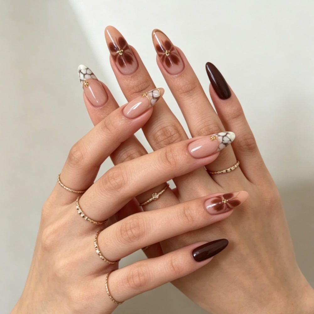 Artificial nails with elegant marble pattern and delicate accents Bowlift