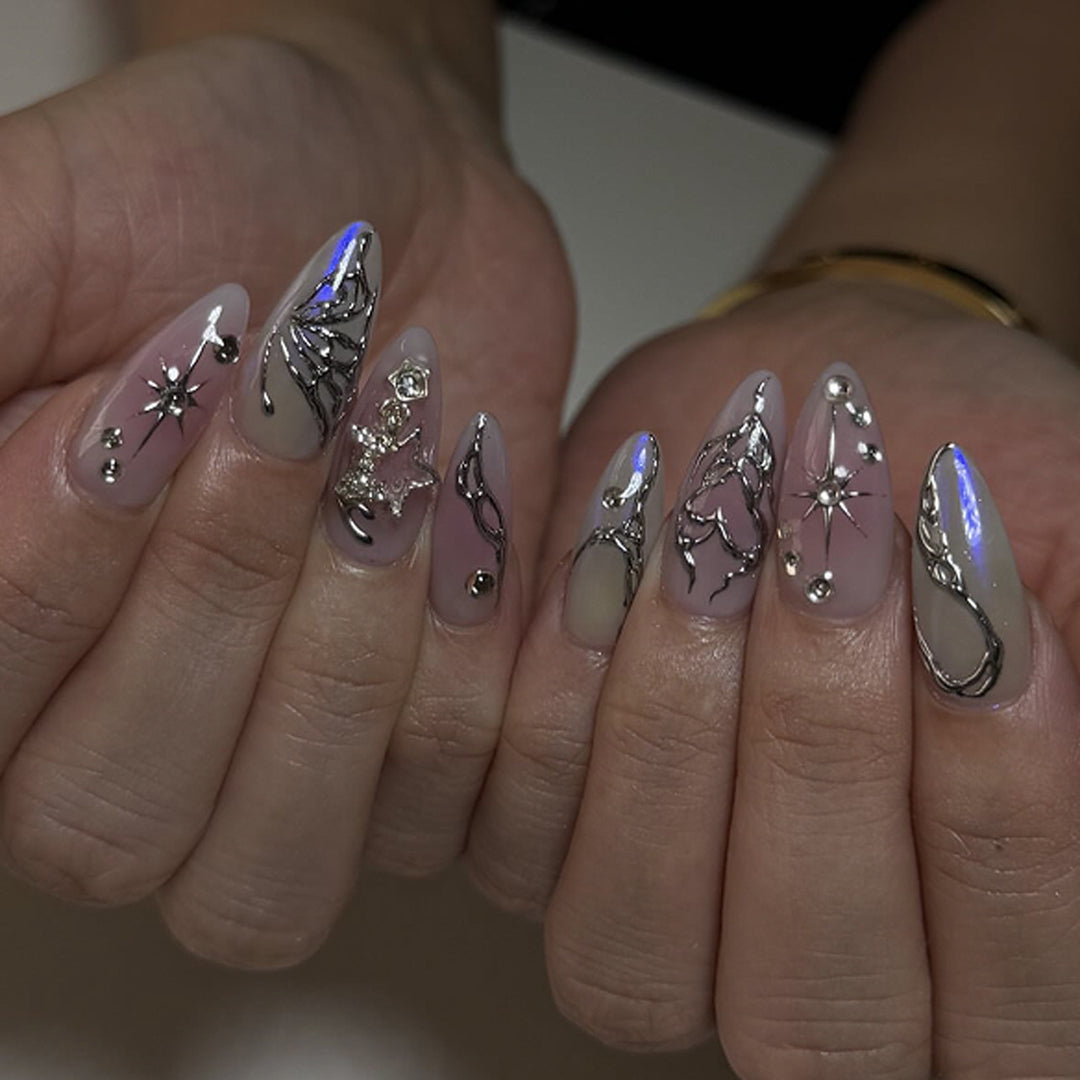 Artistic nail art with unique 3D decorations and glitter accents Bowlift