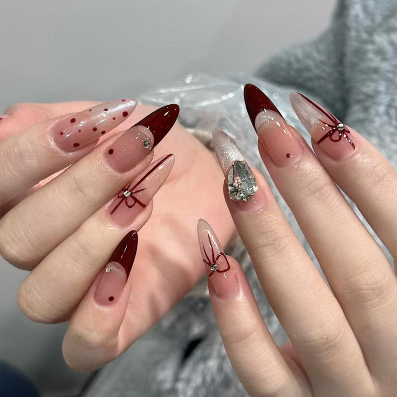 Artificial nail set with elegant bow and glitter details Bowlift