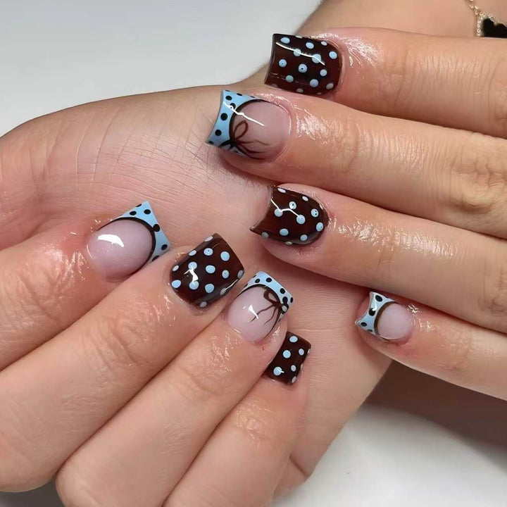 Artful nail extensions with playful dots and elegant design Bowlift