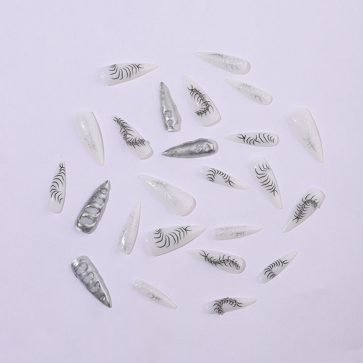Creative nail art set with elegant floral designs and metallic accents Bowlift