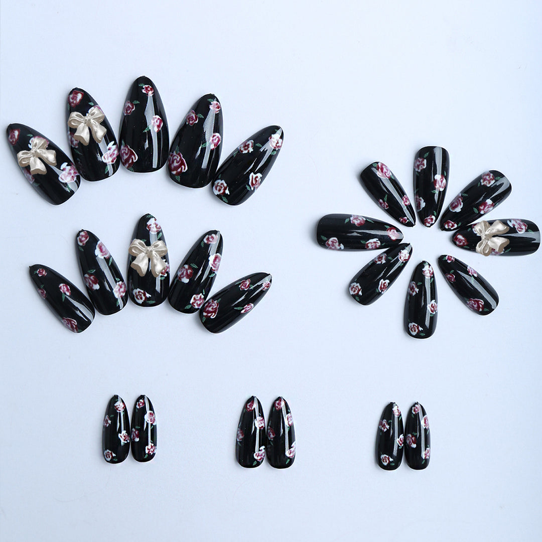 Artificial nails with floral decorations and glamorous bow detail Bowlift