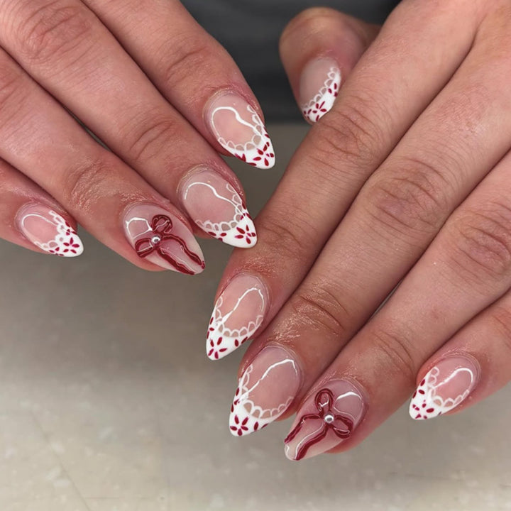 Artful stiletto nails with delicate floral accents Bowlift