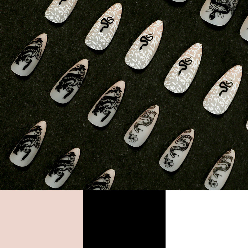 Artful nail extensions in elegant stiletto style with artistic floral and graphic designs Bowlift