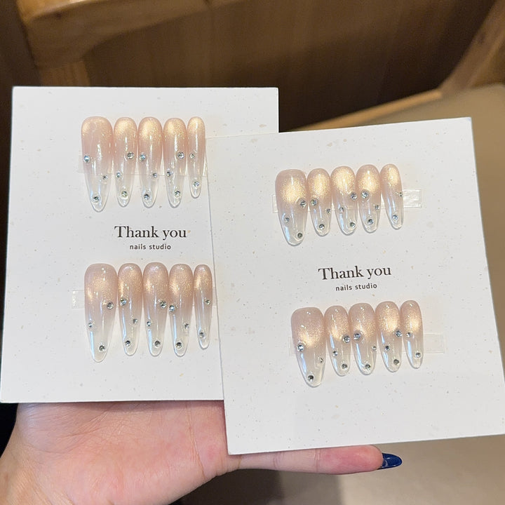 Artificial nails with shimmering accents and elegant rhinestone details Bowlift