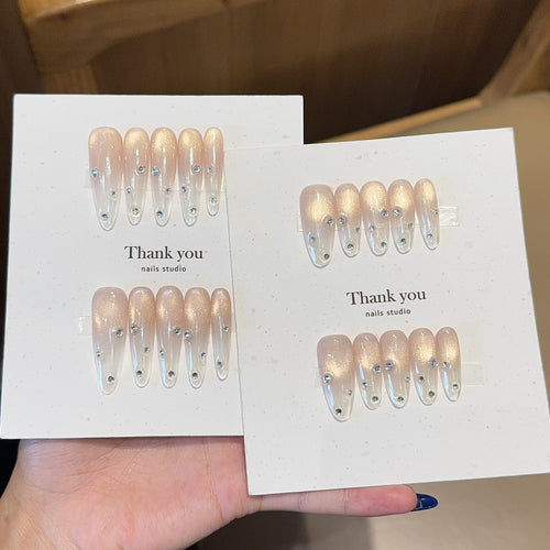 Artificial nails with shimmering accents and elegant rhinestone details Bowlift