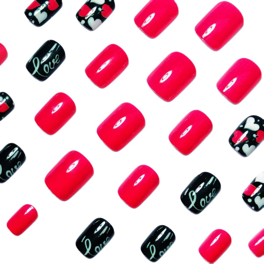 Acrylic nail design with hearts and kiss motifs Bowlift