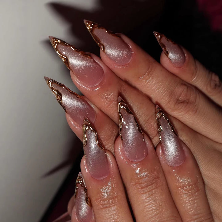 Artificial nails in elegant stiletto design with golden accents Bowlift