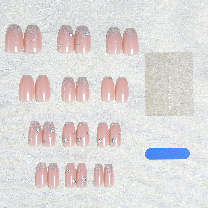 Glamorous artificial nails with glitter and rhinestone embellishments Bowlift