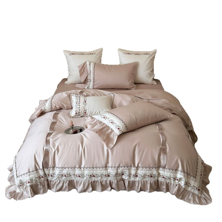 Luxurious embroidered bedding set with ruffles and satin