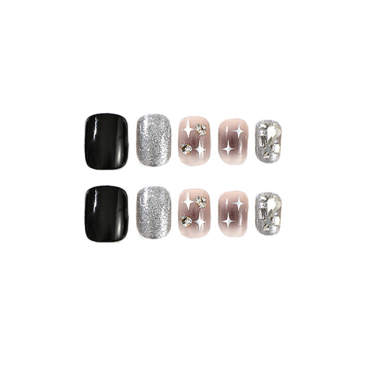 Elegant Nail Art with Glitter and Star Motifs Bowlift