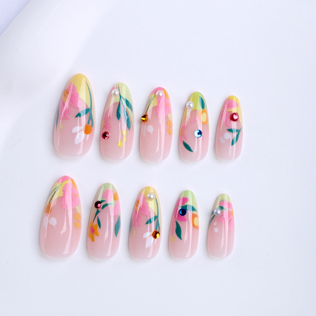 Artificial nails with flower design and glitter accents Bowlift