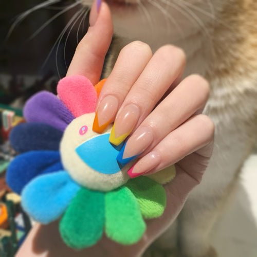Artificial nail art with colorful tips and elegantly accented designs Bowlift
