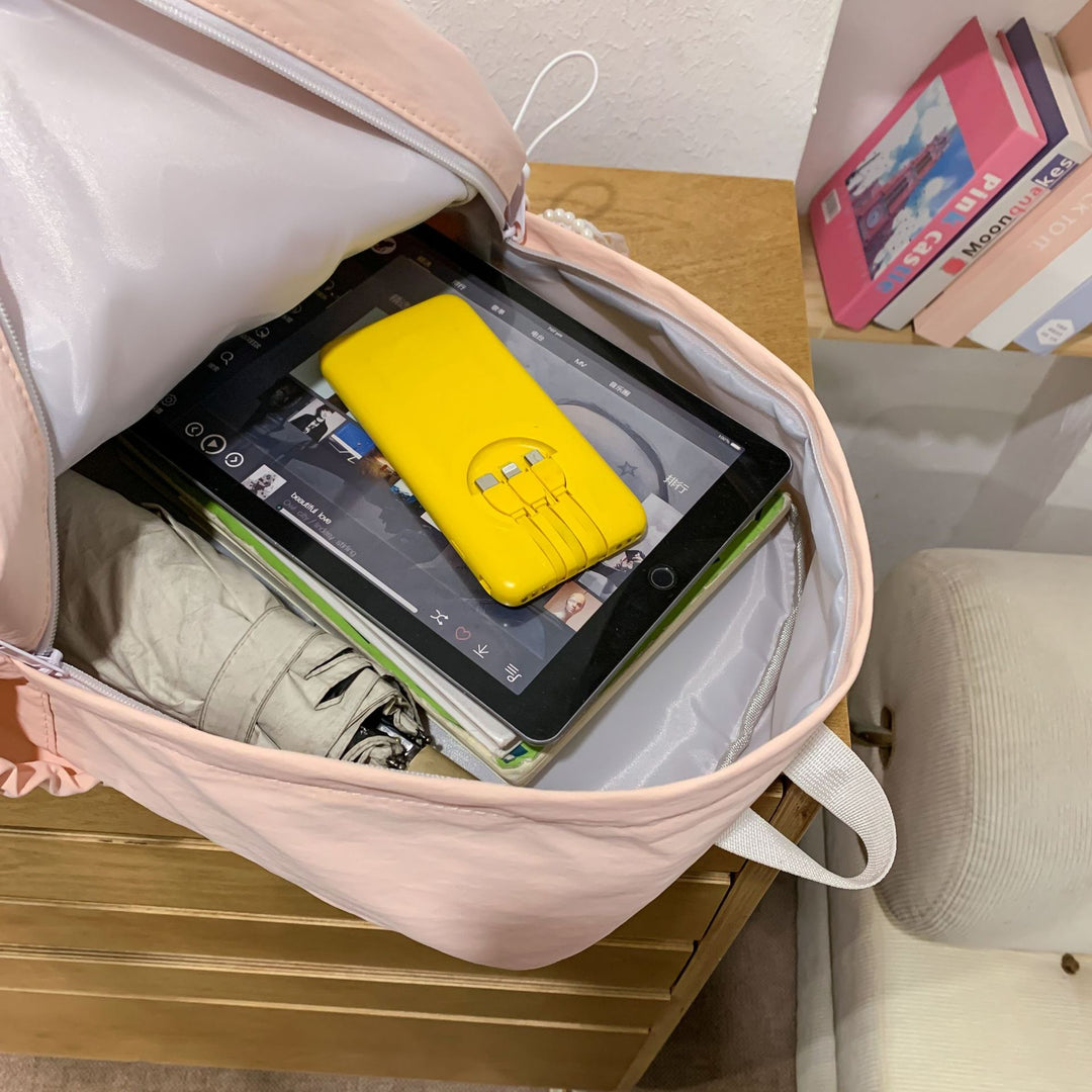 Backpack with elegant pearl applications and intricate design Bowlift