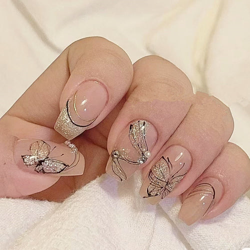 Artificial nails with filigree butterfly design Bowlift