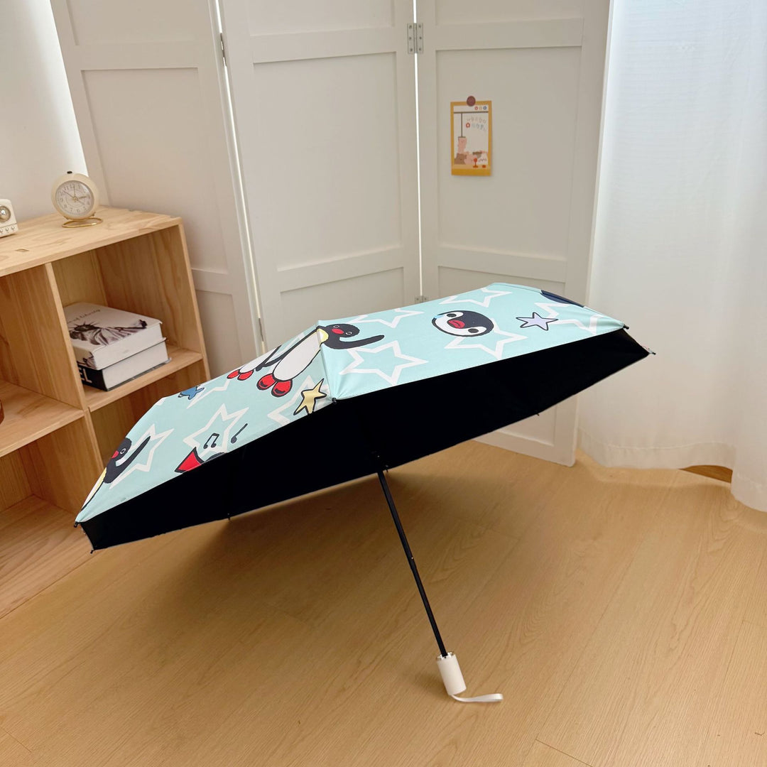Ladies collapsible umbrella with playful penguin design Bowlift
