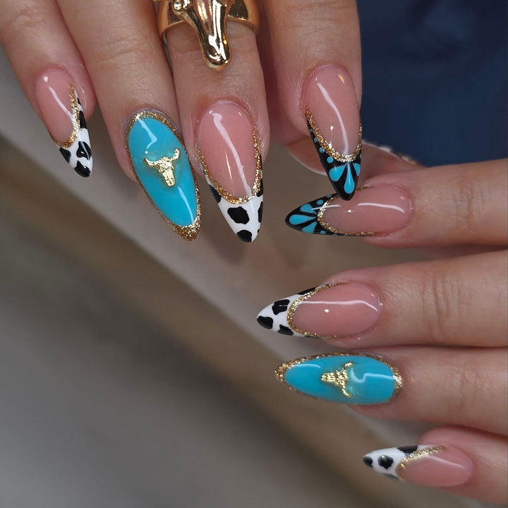 Artistic Stiletto Nail Art Extensions with Cow Print and Gold Accents Bowlift