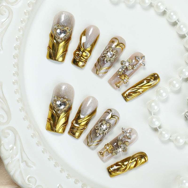 Artificial nail set with luxurious gold embellishments Bowlift