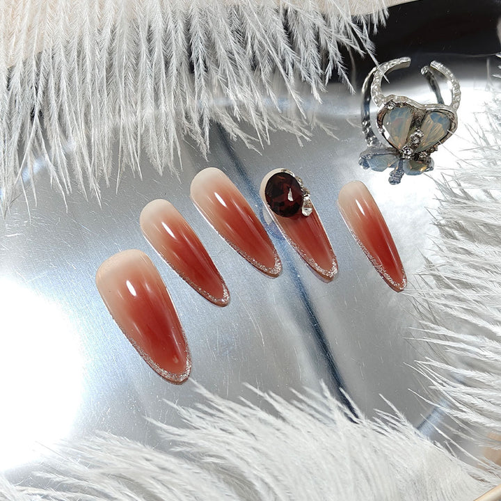 Elegant artificial nails with rhinestone applications Bowlift