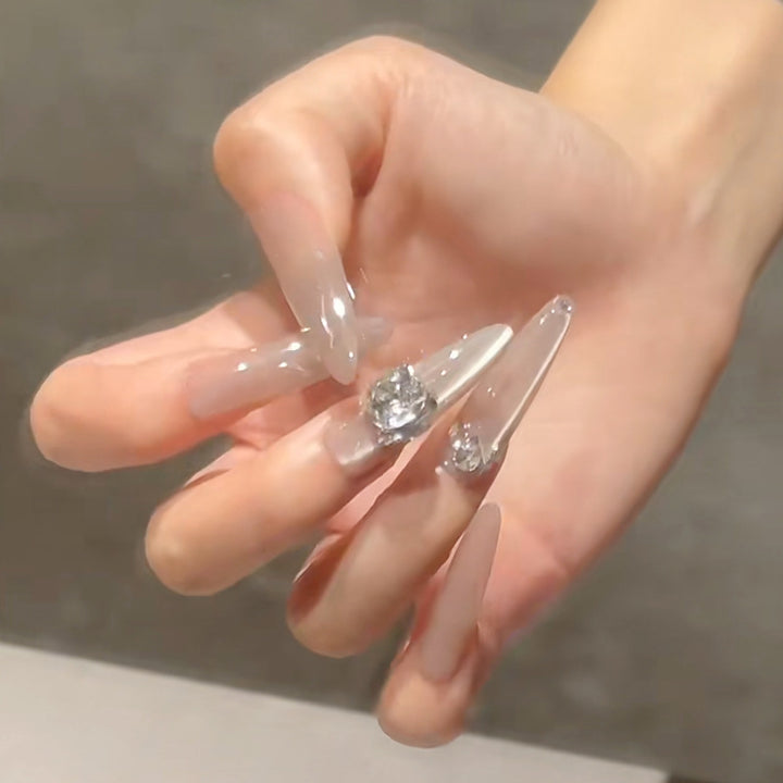 Acrylic nail set with glitter design and elegant 3D applications Bowlift