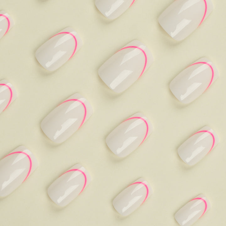 Stylish artificial nails with elegant French tip and modern accents Bowlift