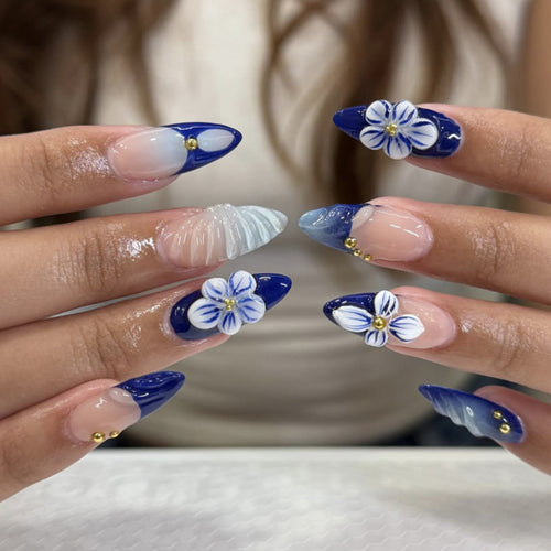 Artistic nail art with floral accents and glitter embellishments Bowlift