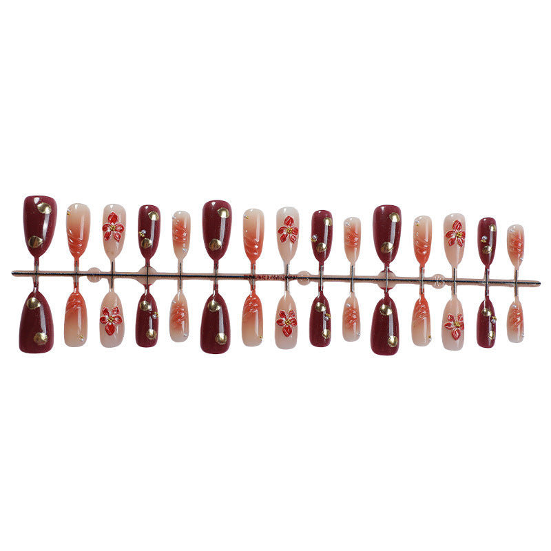 Acrylic nail set with elegant floral accents and glitter details Bowlift